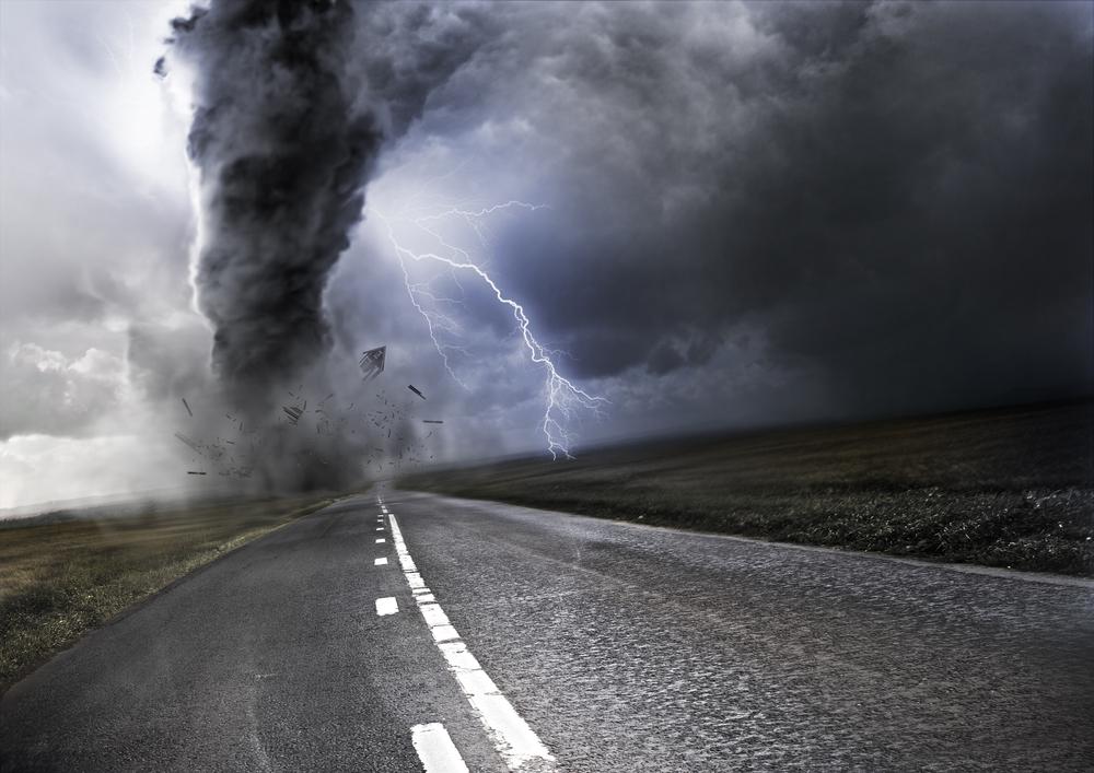 Why do tornadoes often occur after a hurricane lands on land